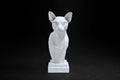 White plaster portrait bust of an Abyssinian cat with large ears on a stepped square base.