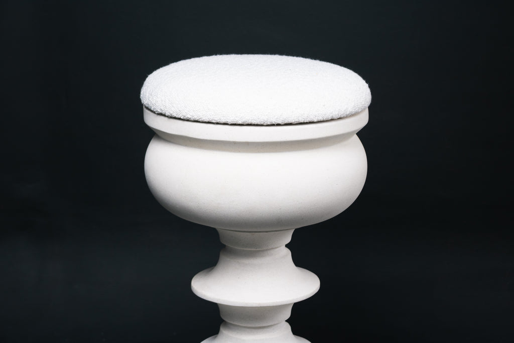 Baluster barstool in white. The base stacks three softly rounded bulbous forms. A broad domed foot, a mid sphere, and an upper globe, connected by a narrow collar, and topped with a wide disc and round white bouclé upholstered seat.