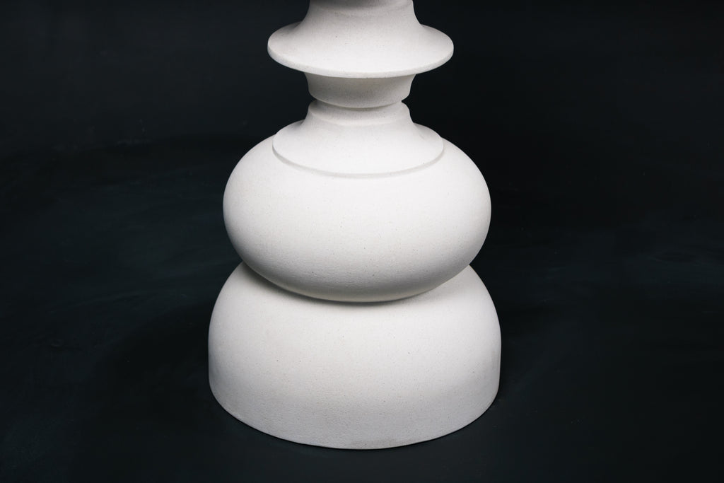 Baluster barstool in white. The base stacks three softly rounded bulbous forms. A broad domed foot, a mid sphere, and an upper globe, connected by a narrow collar, and topped with a wide disc and round white bouclé upholstered seat.