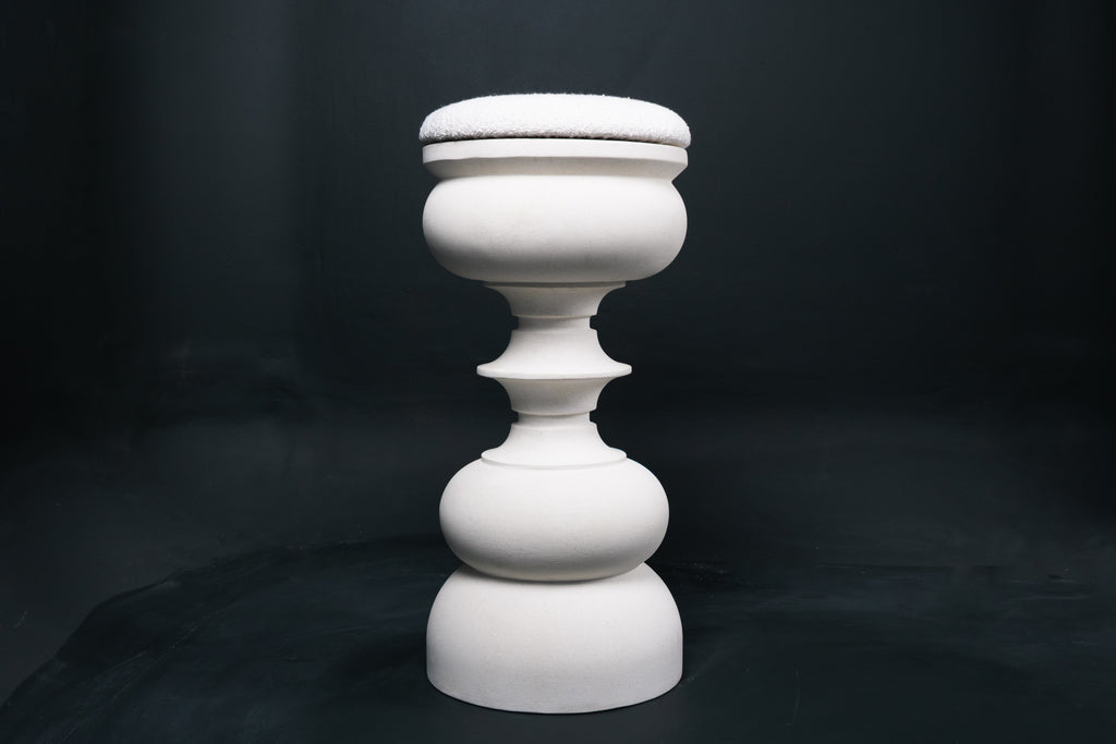 Baluster barstool in white. The base stacks three softly rounded bulbous forms. A broad domed foot, a mid sphere, and an upper globe, connected by a narrow collar, and topped with a wide disc and round white bouclé upholstered seat.