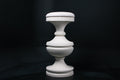Chalice barstool in white. The substantial turned base draws on classical column and urn forms, a layered circular foot rises through a bulbous lower body, pinches to a narrow waist, then flares outward to support a round white bouclé upholstered seat.