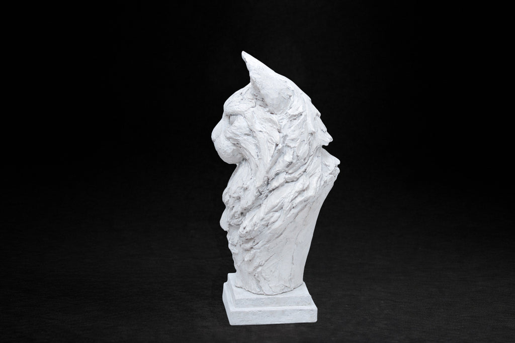 White plaster portrait bust of a Maine Coon cat with a full ruff and tufted ears on a stepped square base.